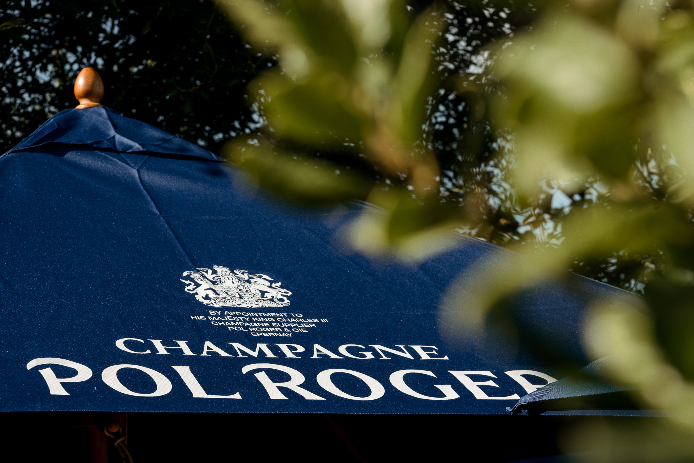 Blue Pol Roger sun umbrella outside on The Terrace at The General Tarleton